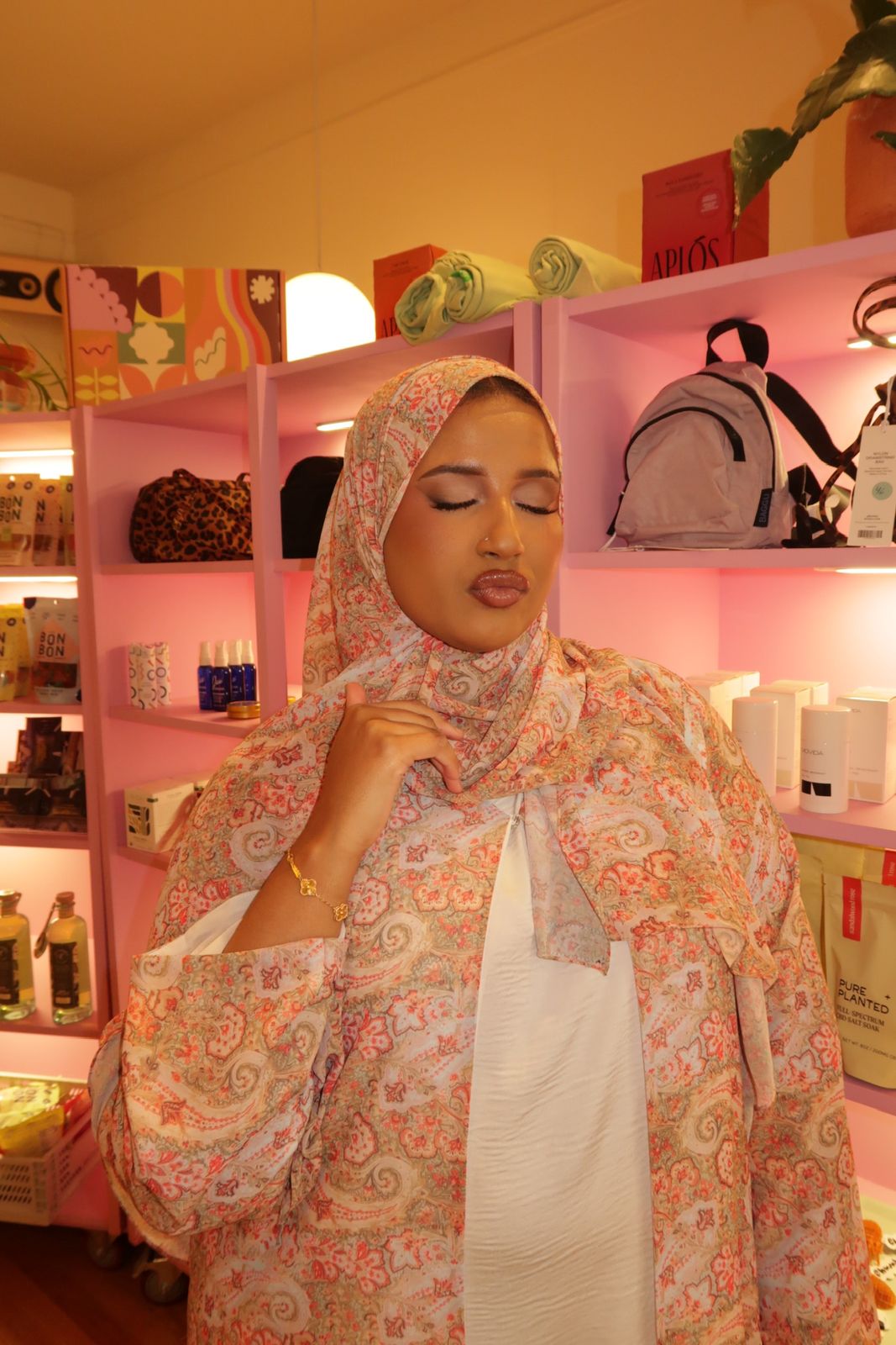 Rose-gold lids, eyes closed — soft glam makeup by Maison Nūr